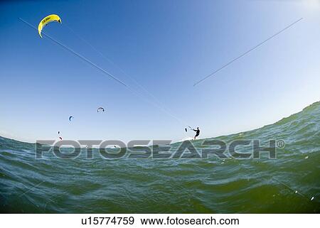 Stock Photo - Extreme kite surfer in the water. Fotosearch