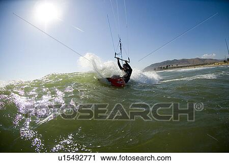 Extreme kite surfer in the waves View Large Photo Image Stock Image - Extreme kite surfer in the waves. Fotosearch