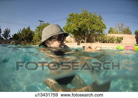 Female with her Chihuahua dog in the pool View Large Photo Image Stock Photo - Female with her Chihuahua dog in the pool. Fotosearch