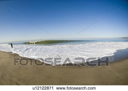 Stock Image - Fisheye view of a wave breaking. Fotosearch