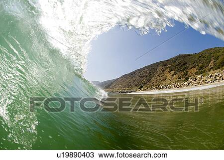 Stock Image - Inside of a wave breaking. Fotosearch