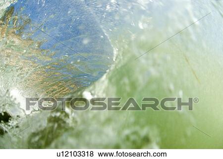 Stock Photo - Inside of a wave breaking. Fotosearch