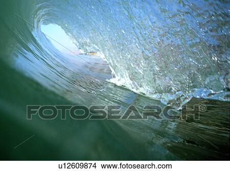 Inside the tube of a breaking wave View Large Photo Image Picture - Inside the tube of a breaking wave. Fotosearch
