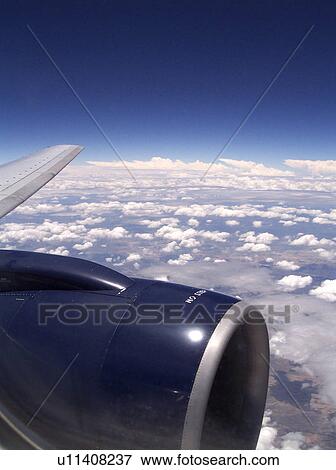 Stock Photo - Jet engine in the sky. Fotosearch