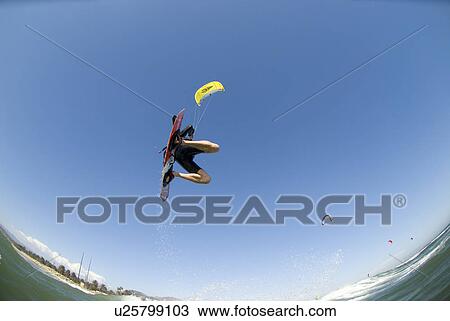 Stock Image - Kite surfer in air. Fotosearch