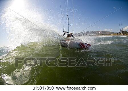 Kite surfer in surf View Large Photo Image Stock Image - Kite surfer in surf. Fotosearch