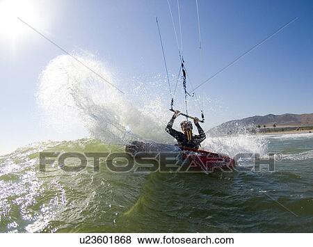 Kite surfer in surf View Large Photo Image Stock Photo - Kite surfer in surf. Fotosearch