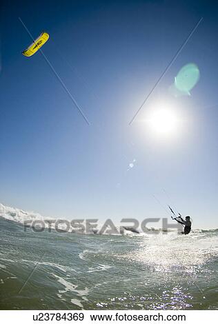 Stock Photo - Kite surfer in water. Fotosearch