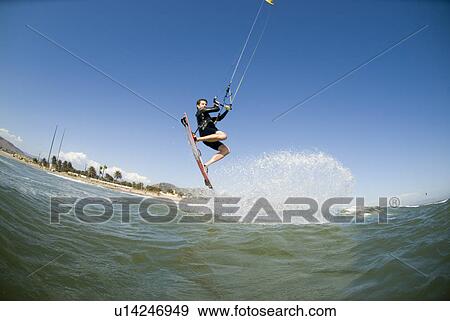 Stock Photo - Kite surfer with in flight. Fotosearch