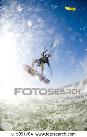 Kite surfing with splashes View Large Photo Image Picture - Kite surfing with splashes. Fotosearch