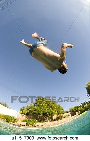 Stock Photo - Male diving into a pool. Fotosearch