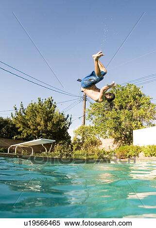 Stock Photography - Male diving into a pool. Fotosearch
