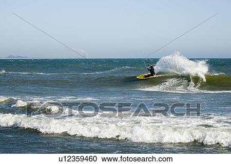 Male kite surfing View Large Photo Image Stock Image - Male kite surfing. Fotosearch