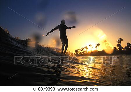Male surfer hangs ten View Large Photo Image Stock Image - Male surfer hangs ten. Fotosearch