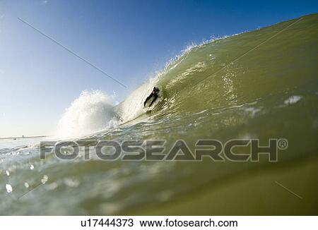 Male surfer in wave View Large Photo Image Stock Image - Male surfer in wave. Fotosearch