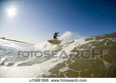 Stock Photograph - Male surfer. Fotosearch