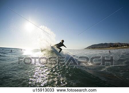 Male surfer surfing View Large Photo Image Stock Image - Male surfer surfing. Fotosearch