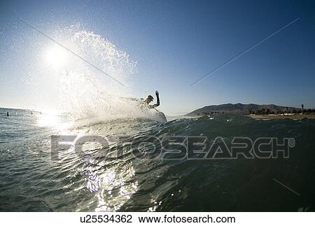Male surfer surfing View Large Photo Image Stock Image - Male surfer surfing. Fotosearch