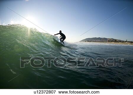 Male surfer surfing View Large Photo Image Stock Photo - Male surfer surfing. Fotosearch