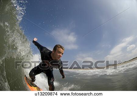 Male surfing View Large Photo Image Picture - Male surfing. Fotosearch