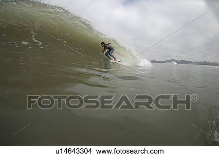 Picture - Male surfing. Fotosearch