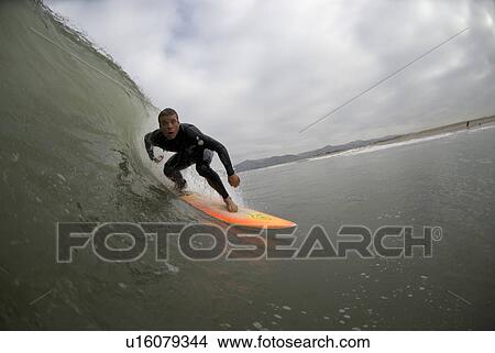 Picture - Male surfing. Fotosearch