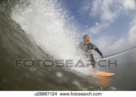 Picture - Male surfing. Fotosearch
