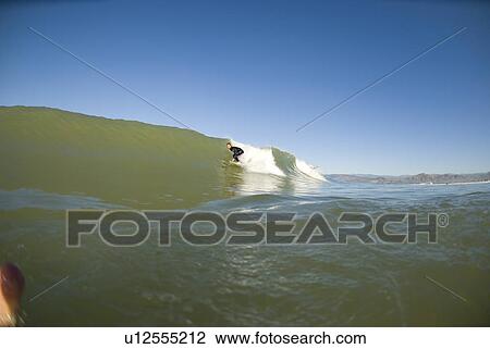 Stock Image - Male surfing. Fotosearch