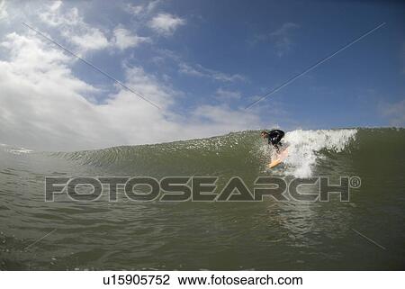 Stock Image - Male surfing. Fotosearch