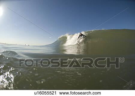 Stock Image - Male surfing. Fotosearch