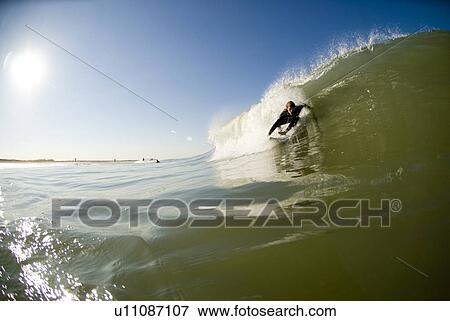Stock Photo - Male surfing. Fotosearch