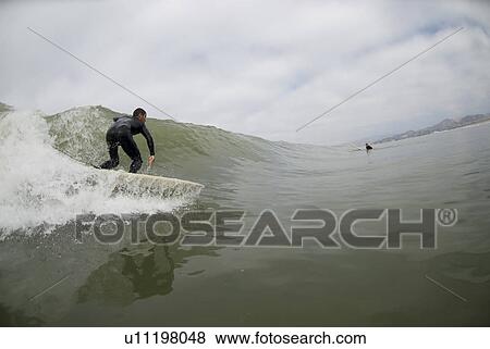 Male surfing View Large Photo Image Stock Photo - Male surfing. Fotosearch