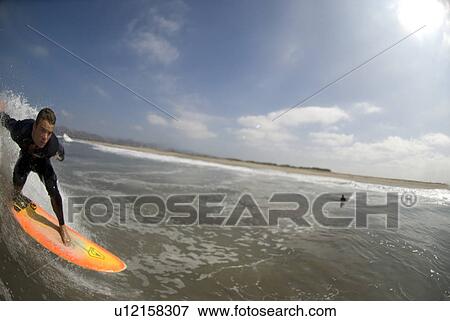 Stock Photo - Male surfing. Fotosearch
