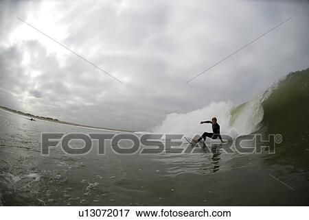 Stock Photo - Male surfing. Fotosearch