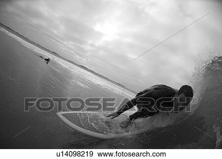 Stock Photo - Male surfing. Fotosearch