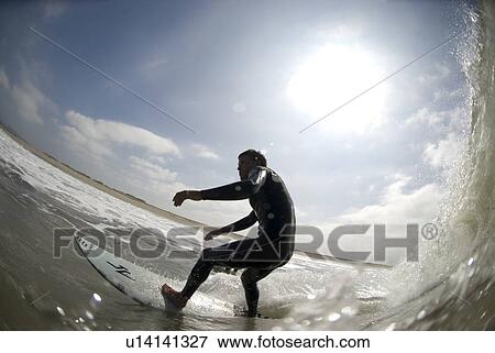 Stock Photo - Male surfing. Fotosearch