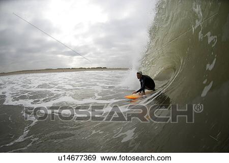 Male surfing View Large Photo Image Stock Photo - Male surfing. Fotosearch