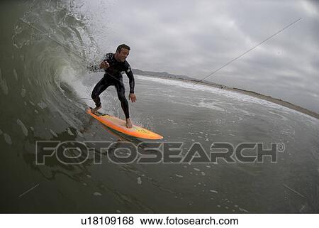 Male surfing View Large Photo Image Stock Photo - Male surfing. Fotosearch