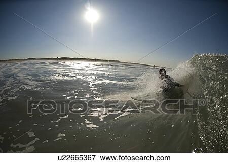 Stock Photo - Male surfing. Fotosearch