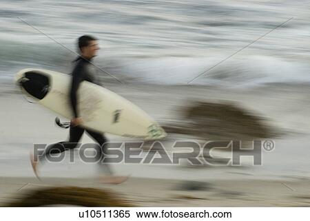 Stock Photography - Male surfing. Fotosearch