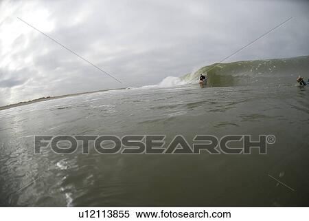 Stock Photography - Male surfing. Fotosearch