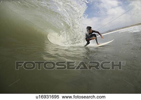 Stock Photography - Male surfing. Fotosearch