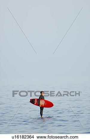 Male with surfboard View Large Photo Image Picture - Male with surfboard. Fotosearch