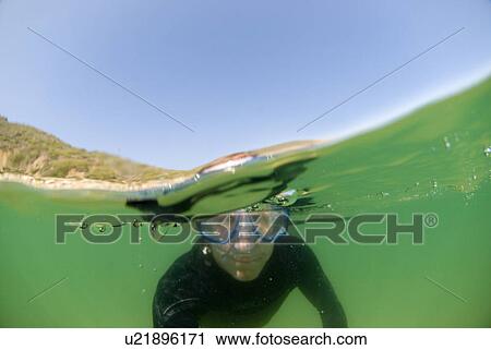 Man underwater with goggles on View Large Photo Image Stock Image - Man underwater with goggles on. Fotosearch
