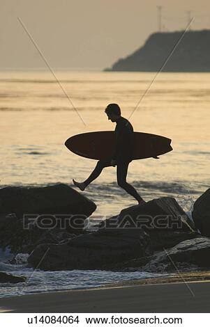 Man with surfboard View Large Photo Image Picture - Man with surfboard. Fotosearch