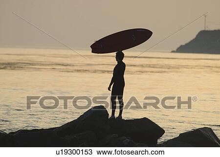 Man with surfboard View Large Photo Image Stock Image - Man with surfboard. Fotosearch