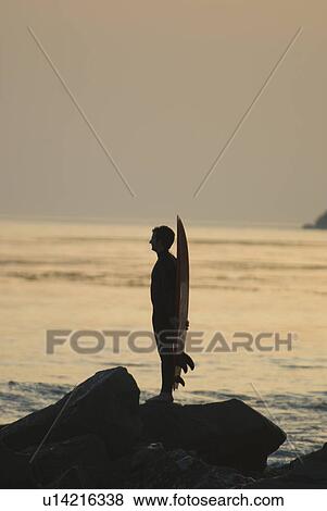 Man with surfboard View Large Photo Image Stock Photo - Man with surfboard. Fotosearch