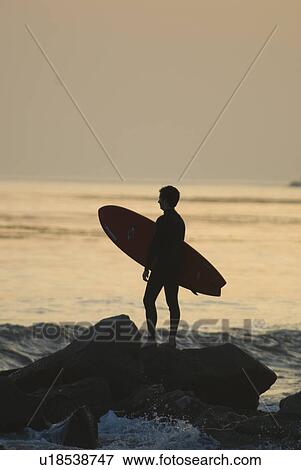 Man with surfboard View Large Photo Image Stock Photo - Man with surfboard. Fotosearch