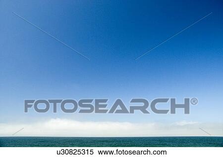 Stock Photography - Ocean and clouds and a lot of sky. Fotosearch