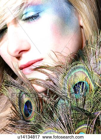 Peacock lady with feathers View Large Photo Image Stock Photo - Peacock lady with feathers. Fotosearch